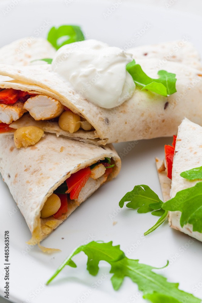 tortilla filled with chicken meat, red pepper and beans tortilla filled with chicken meat, red pepper and beans