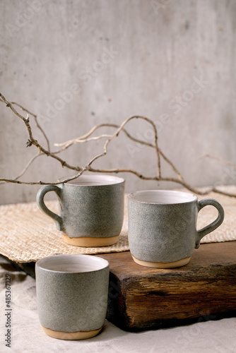 Set of empty craft ceramic coffee cups © Natasha Breen