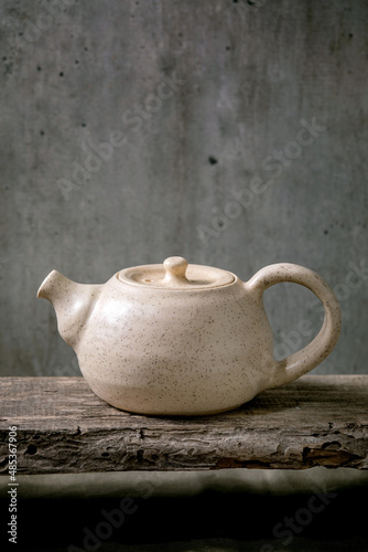 Craft handmade ceramic teapot kettle for tea ceremony photo