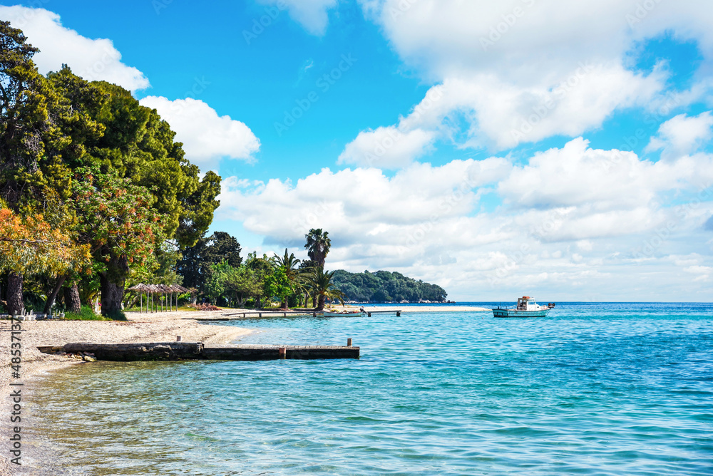 Beautiful scenic landscape with a boat in the bay near the beach in Nydri, Lefkada, Greece. Stunning amazing charming places. prominent tourist towns.