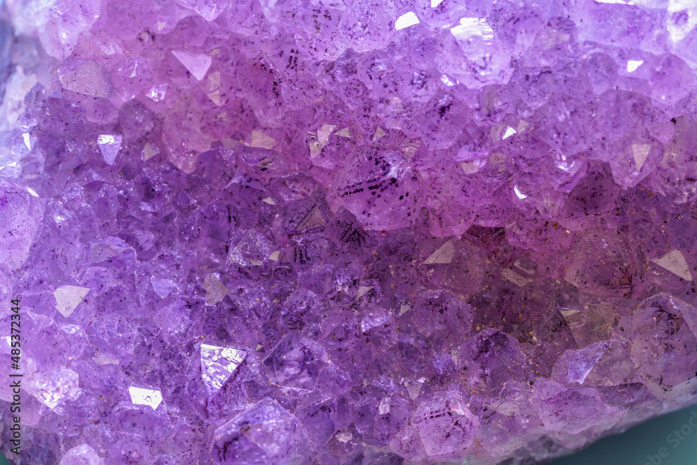 Quartz with mineral inclusions in the studio in front of a background photographed in Marco mode Quartz with mineral inclusions in the studio in front of a background photographed in Marco mode
