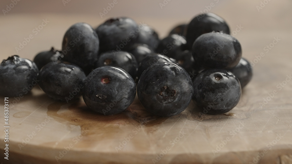 fresh blueberries on olive wood board fresh blueberries on olive wood board