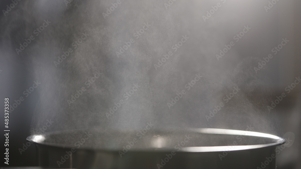 steam rising from saucepan closeup