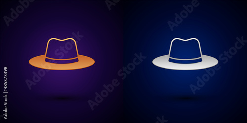 Gold and silver Man hat with ribbon icon isolated on black background. Vector