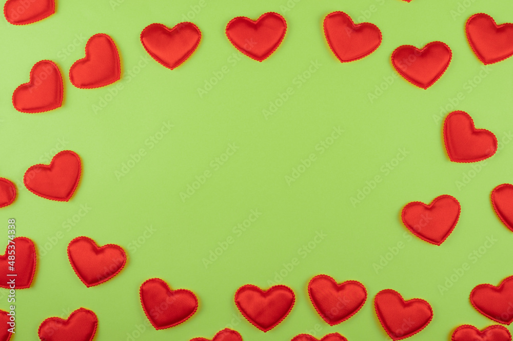 Valentine day green paper background with red hearts background. Valentines day or love concept, copy space