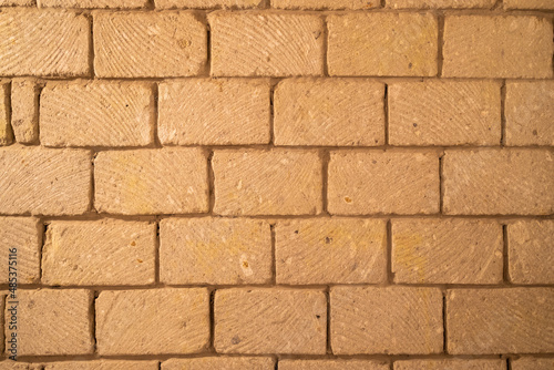 wall built of stone blocks of tuff
