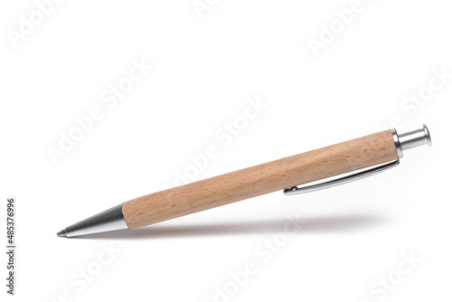 Closeup business pen covered wood white background