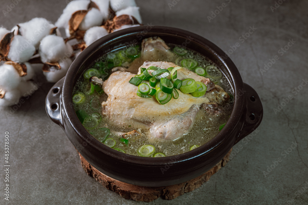 Samgyetang, Korean Ginseng Chicken Soup : Tender, whole, young chicken stuffed with ginseng, jujubes, sweet rice, and whole garlic cloves and simmered until tender. The combination of chicken and gins Samgyetang, Korean Ginseng Chicken Soup : Tender, whole, young chicken stuffed with ginseng, jujubes, sweet rice, and whole garlic cloves and simmered until tender. The combination of chicken and gins