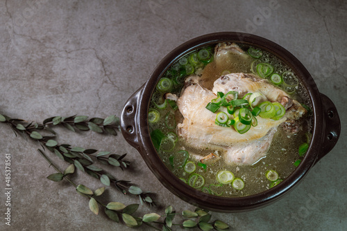 Samgyetang, Korean Ginseng Chicken Soup : Tender, whole, young chicken stuffed with ginseng, jujubes, sweet rice, and whole garlic cloves and simmered until tender. The combination of chicken and gins