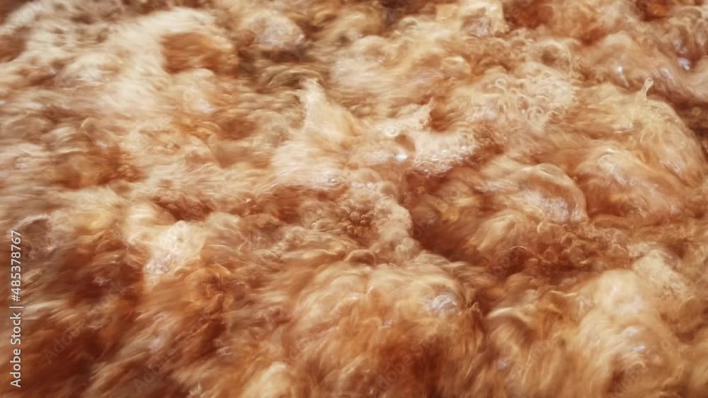 Frying food in boiling oil. Deep fried food. Heavily used and high