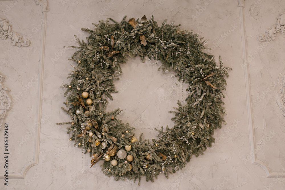 Fototapeta premium Christmas wreath made of spruce on a light background