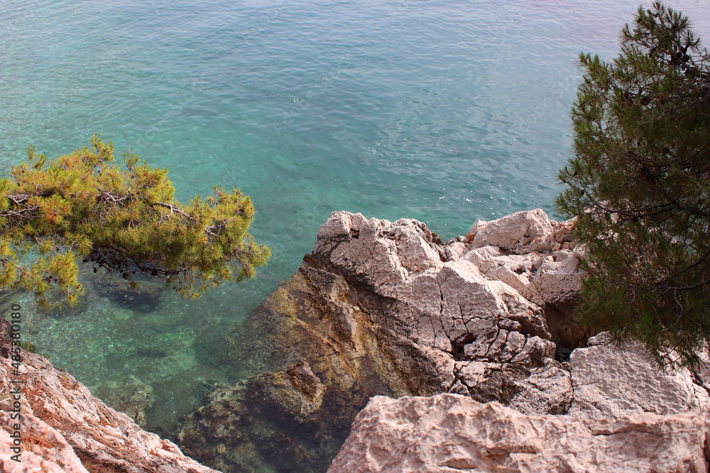 Turquoise clear waters of the Adriatic Sea. Rocky shores. Milocer park. Montenegro