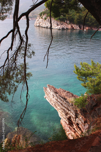 Turquoise clear waters of the Adriatic Sea. Rocky shores. Milocer park. Montenegro