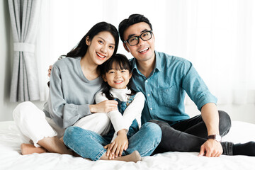 small asian family portrait at home