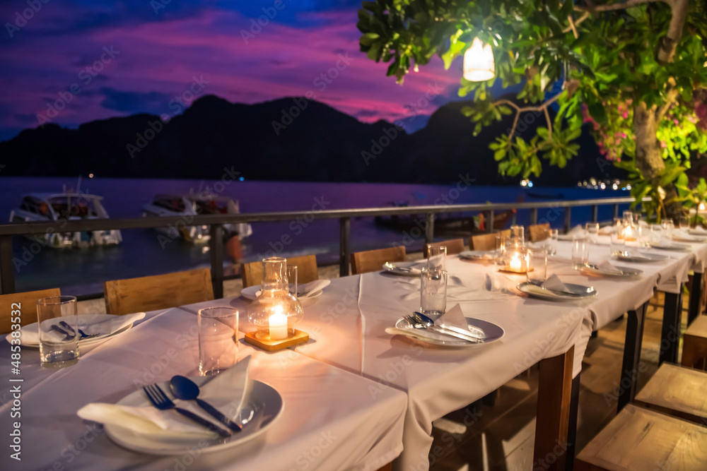 Dinner table by Phi Phi beach view at sunset