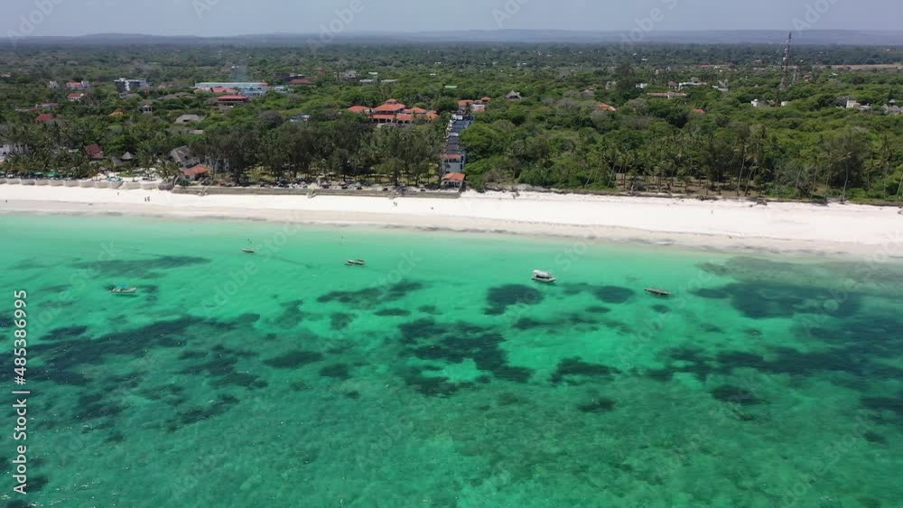 Diani beach landscape Kenyan coast African Sea drone aerial 4k waves blue indan ocean tropical mombasa turquoise white sand East Africa palms paradise view Wood boats on water Diani beach landscape Kenyan coast African Sea drone aerial 4k waves blue indan ocean tropical mombasa turquoise white sand East Africa palms paradise view Wood boats on water