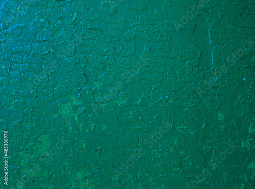 Abstract colored background of green paint on the wall.