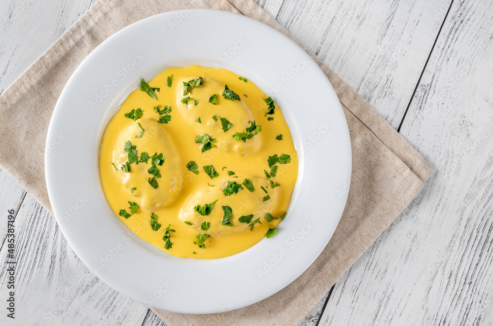 Quenelle with Hollandaise sauce Quenelle with Hollandaise sauce