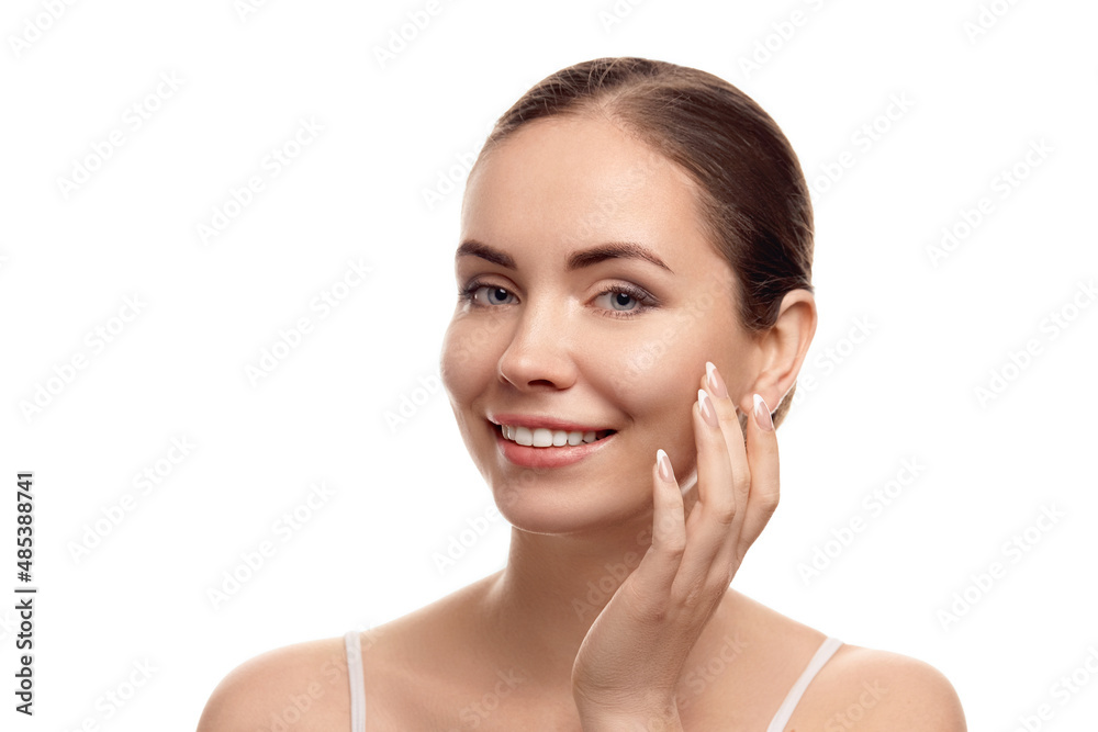 Beautiful young woman with clean fresh skin touch own face. Girl apply moisturizing cream. Facial treatment. Skin care. Cosmetology, beauty and spa. Beautiful young woman with clean fresh skin touch own face. Girl apply moisturizing cream. Facial treatment. Skin care. Cosmetology, beauty and spa.