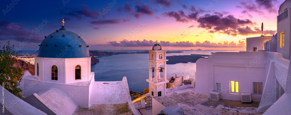 Fantastic Sunset night view of traditional Greek village Fira on Santorini island, Greece, Europe. luxury travel. famous travel landscape. Summer holidays. Travel concept background.