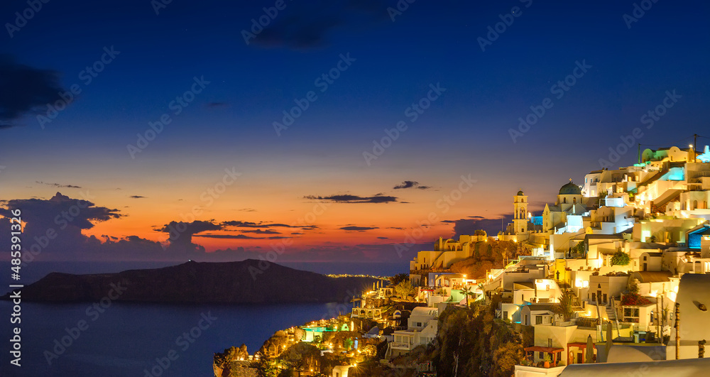 Fantastic Sunset night view of traditional Greek village Fira on Santorini island, Greece, Europe. luxury travel. famous travel landscape. Summer holidays. Travel concept background.
