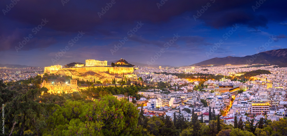 Panorama of night Athens with Acropolis hill crowned by the Parthenon, Athens, Greece, Europe. The Old Acropolis is the main attraction of Athens.