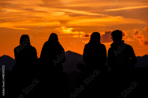silhouette of friends at sunset
