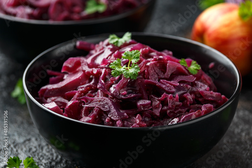 Braised Red Cabbage with apples and redcurrant in black bowl