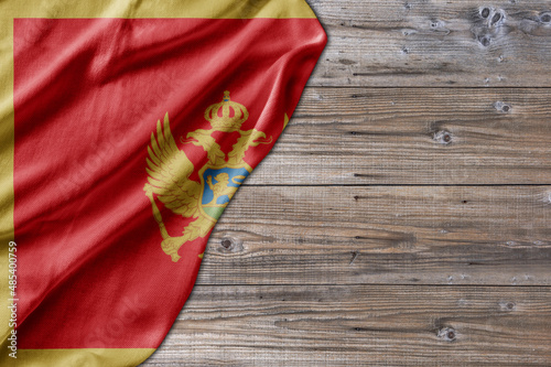 Wooden pattern old nature table board with Montenegro flag