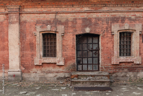 The Metropolitan's Chamber windows and a door in the Krutitsy Metochion by autumn day © Anastasiia Soina