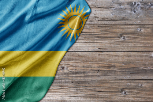 Wooden pattern old nature table board with Rwanda flag