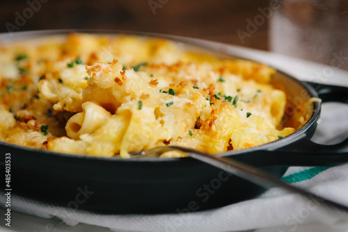 Mac and Cheese with butternut squash and bacon in a cast iron dish