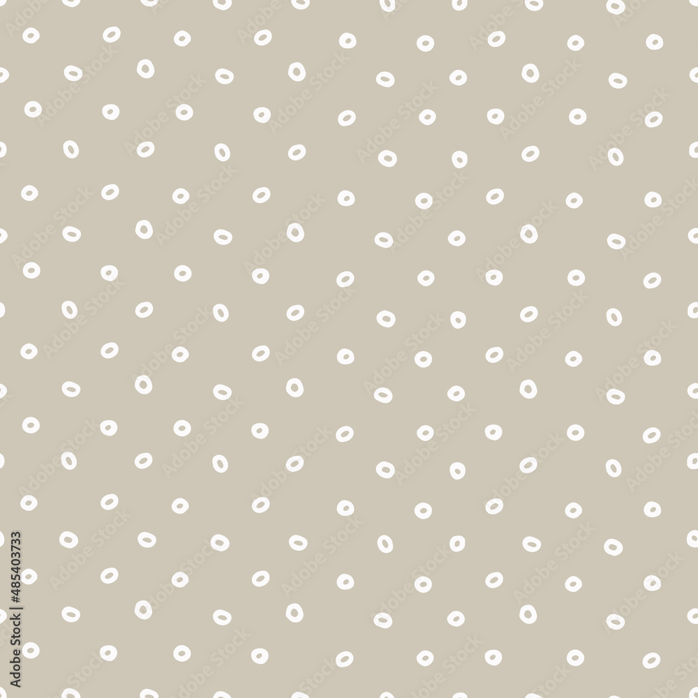 Seamless geometric pattern with hand drawn uneven white rings on beige background for surface design, craft, apparel and other design projects Seamless geometric pattern with hand drawn uneven white rings on beige background for surface design, craft, apparel and other design projects