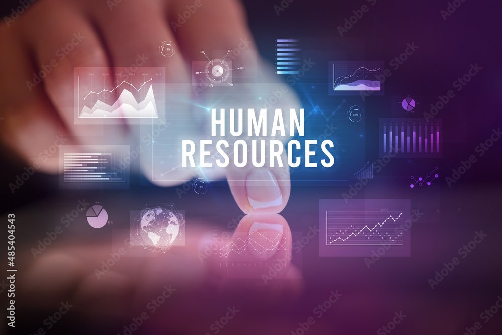 Finger touching tablet with business graphs and icons concept