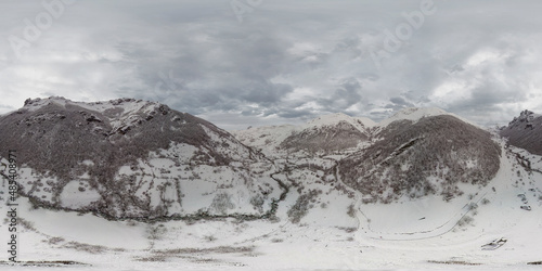 Snow in aerial panorama with my drone in Saliencia River in Somiedo Natural Park in Asturias photo