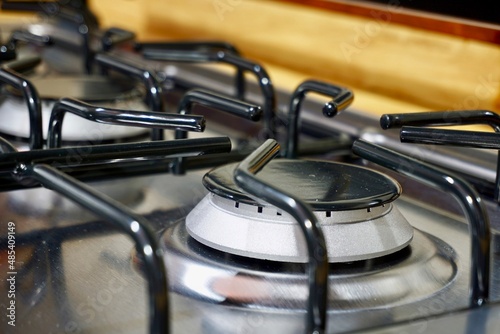 Closeup of a black kitchen burner on a stove
