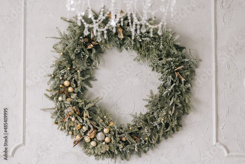 Christmas wreath made of spruce on a light background