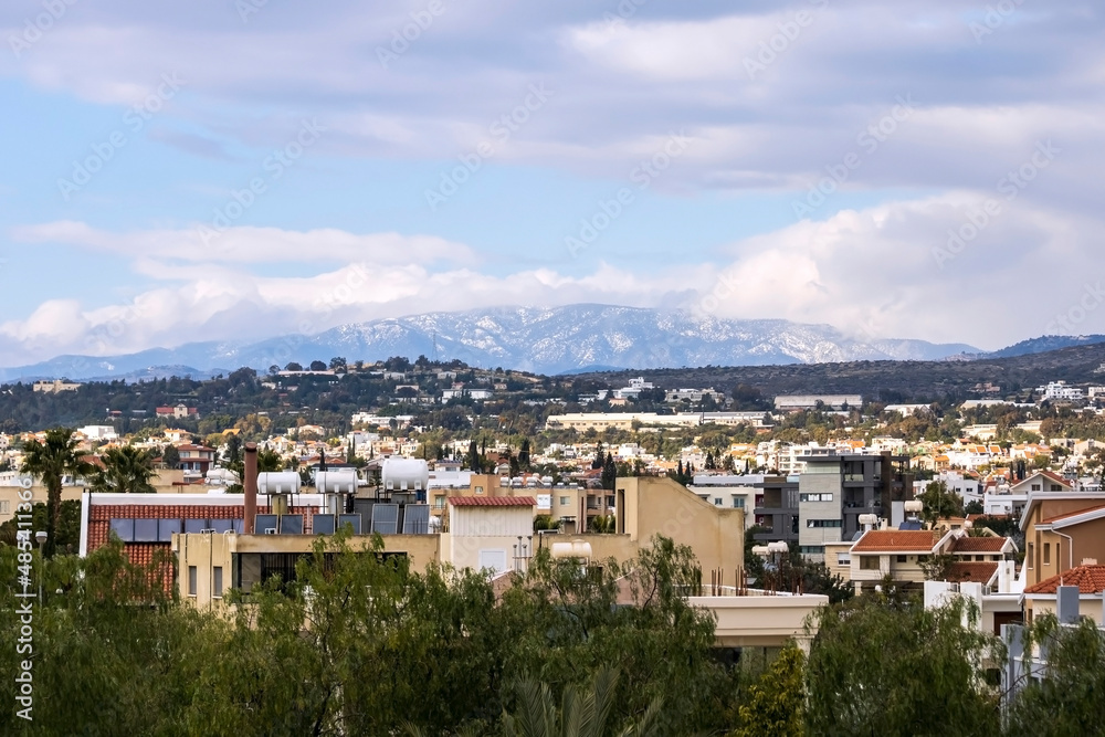 View of Limassol city in front of snowy Troodos mountains, Cyprus