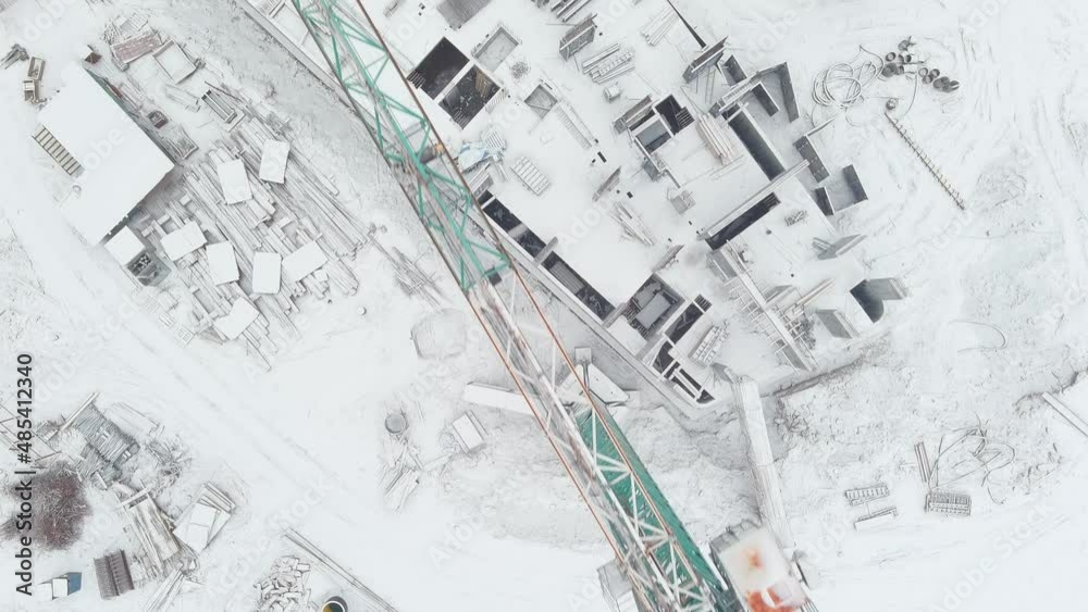 Construction of a multi-storey building using a crane and concrete. Drone video Construction of a multi-storey building using a crane and concrete. Drone video
