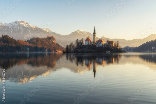 Beautiful view to Lake Bled, the most famous Slovenian lake and island Bled with Pilgrimage Church of the Assumption of Maria and Bled castle at dawn