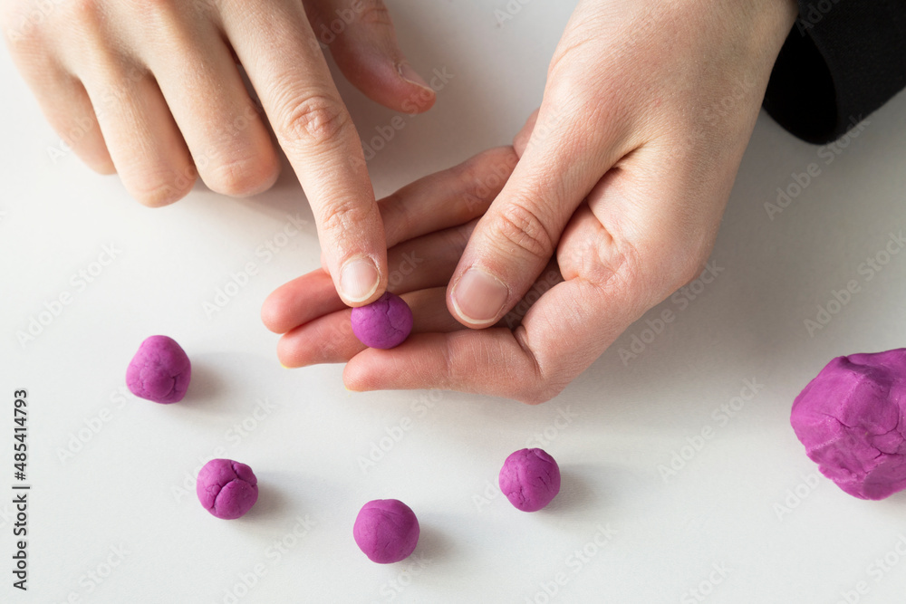 Making grape game step by step with dough for children's activity in the school art lesson and plasticine concept. Making grape game step by step with dough for children's activity in the school art lesson and plasticine concept.