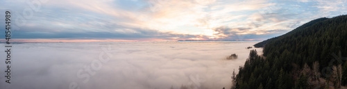 Panoramic View of Canadian Nature Mountain Landscape covered in cloud and fog. West Vancouver  British Columbia  Canada. Aerial background panorama