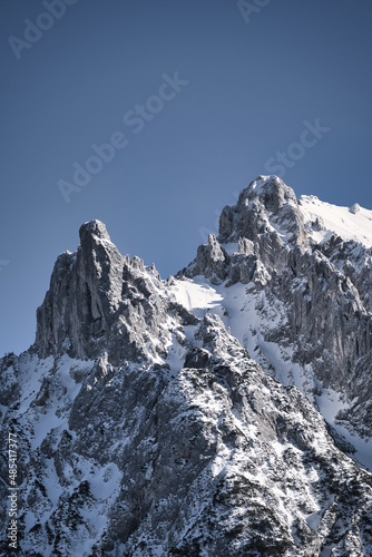 Karwendel - winter landscape with snow covered mountains, rocks and blue sky © Hanjin