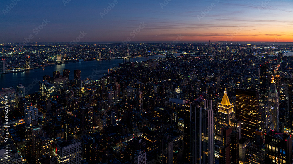 Obraz premium Beautiful night paronama cityscape of new york city downtown with a colourful sky