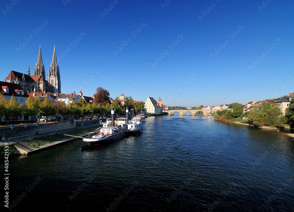 View From The Donau River To The UNESCO Heritage Old City Of Regensburg Germany On A Beautiful Sunny Autumn Day With A Clear Blue Sky
