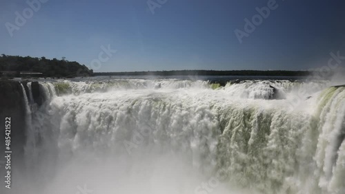 Power of nature. View of the Iguazú falls world wonder. The beautiful white water torrent flowing texture and pattern in Garganta del Diablo.  photo