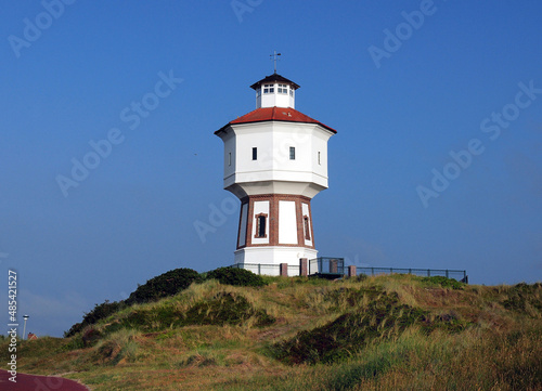 Ancient Water Tower On The East Frisian Island Langeoog Germany On A Beautiful Sunny Summer Day With A Clear Blue Sky © Joerg