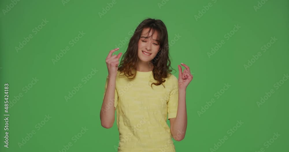 Smiling young girl show small size gesture, beg little more discount or salary increase on chroma key background Smiling young girl show small size gesture, beg little more discount or salary increase on chroma key background