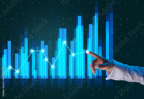 holographic graph with growing indicators and a woman's hand. Business growth concept, profitable startup, profitable business strategy