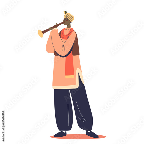Traditional indian artist musician man in national clothes playing on shehnai flute photo